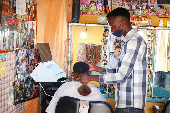 A young man is running a hair saloon